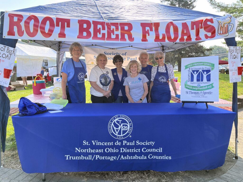 Root Beer Float stand at SVDP event with volunteers