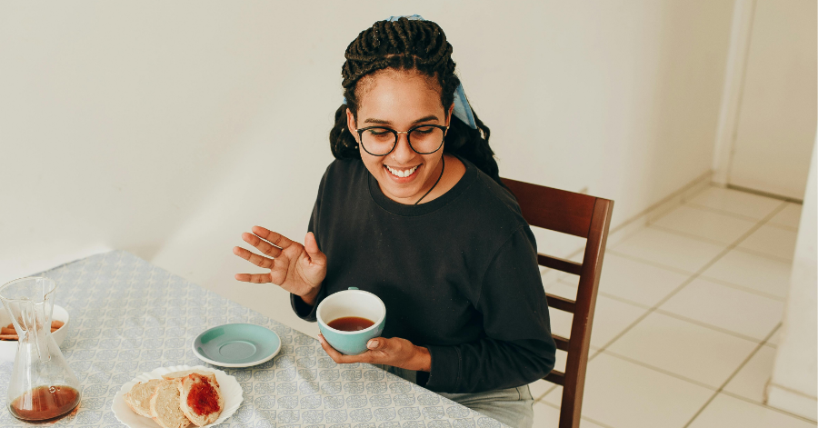 Woman holding cup of coffee