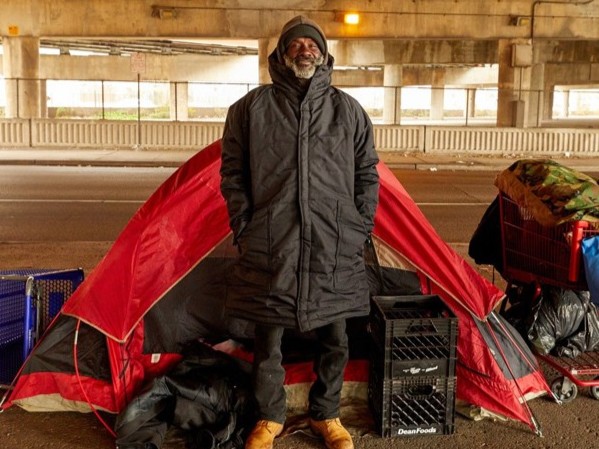 Man wearing EMPWR Coat outside