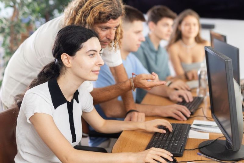group of people working on computers
