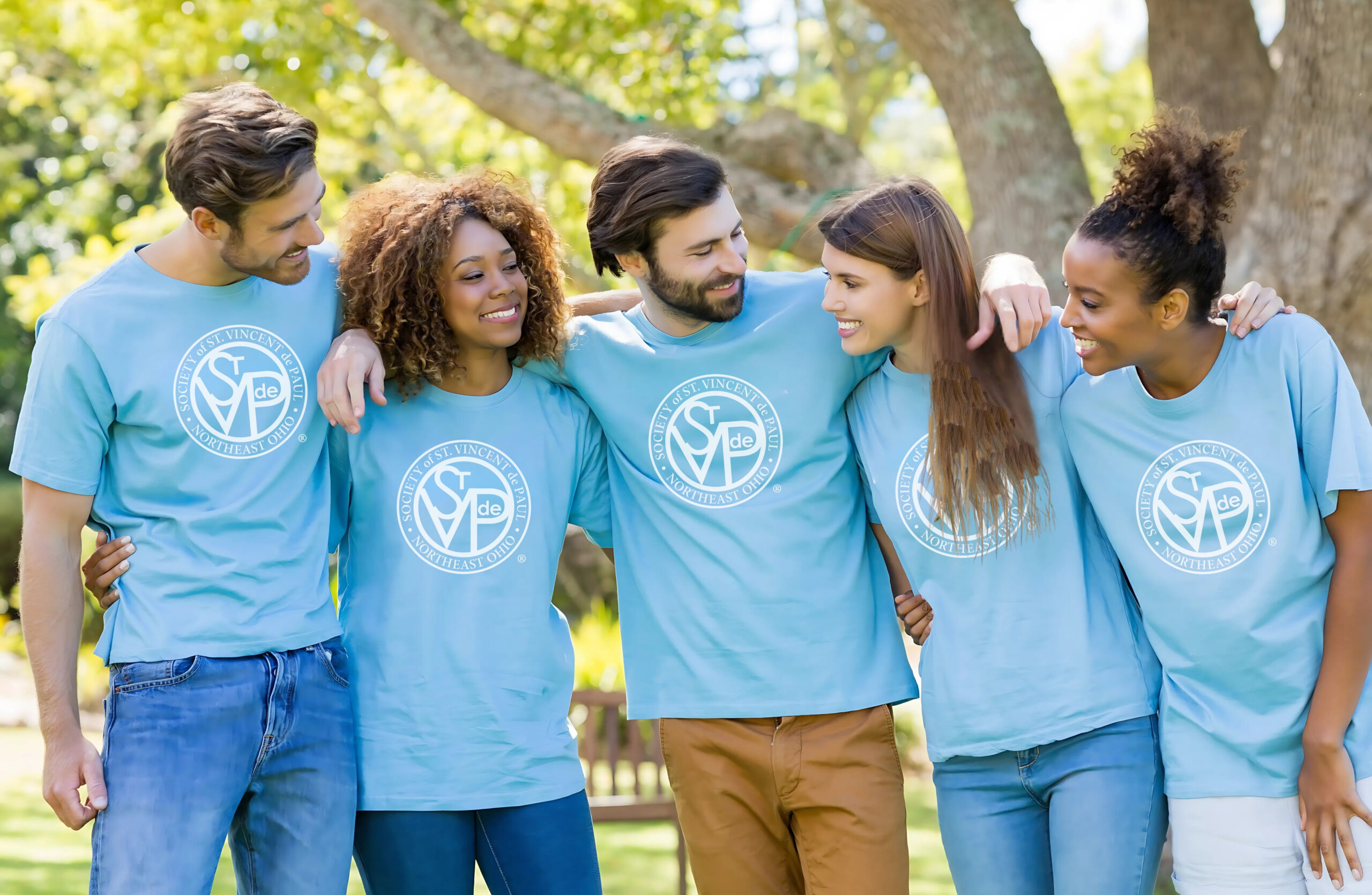 SVDP members smiling with arms around each other