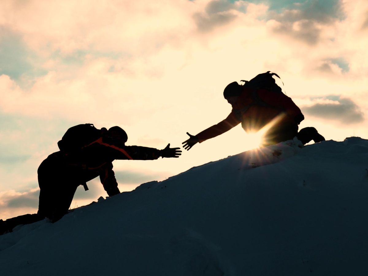 hikers with sun in background